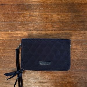 Navy blue Vera Bradley wristlet with rose pattern inside